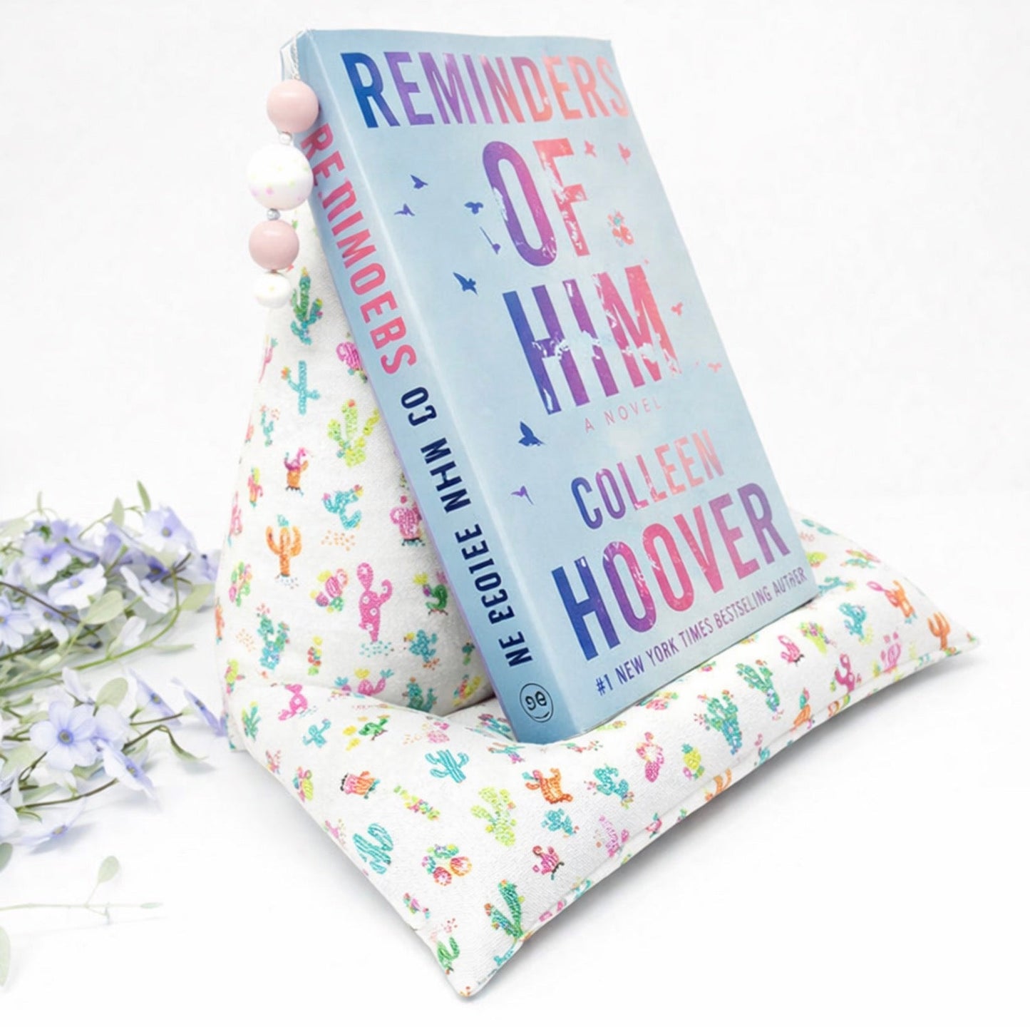 Cactus print book pillow stand supporting an open book for comfortable reading