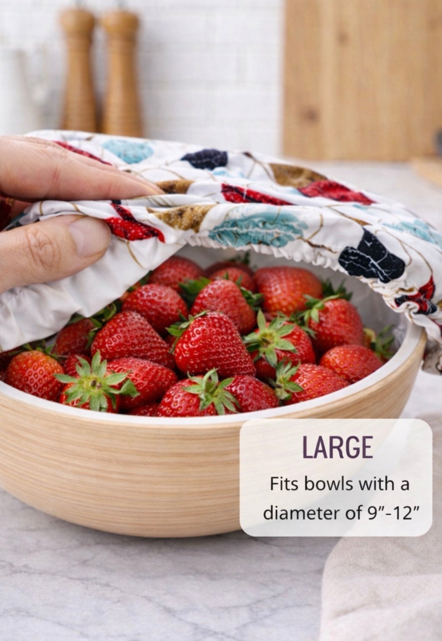 Large reusable fabric bowl cover on wooden bowl of strawberries, fits 9–12 inch bowls for food storage