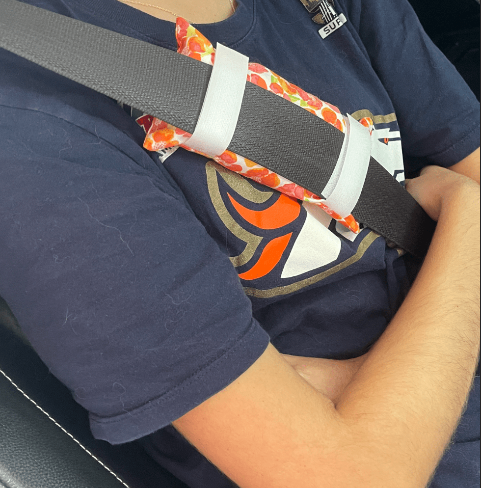 Chemo port pillow worn with seatbelt to reduce pressure and discomfort on chest port during car rides